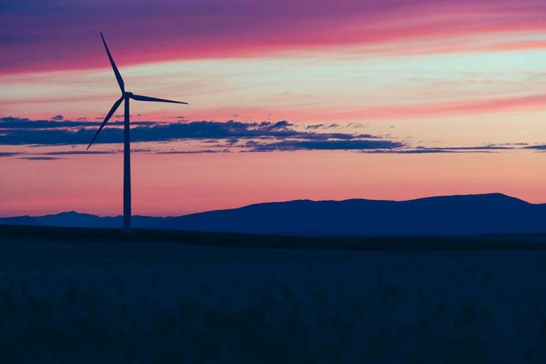 Windmill silhouette in a sunset sky