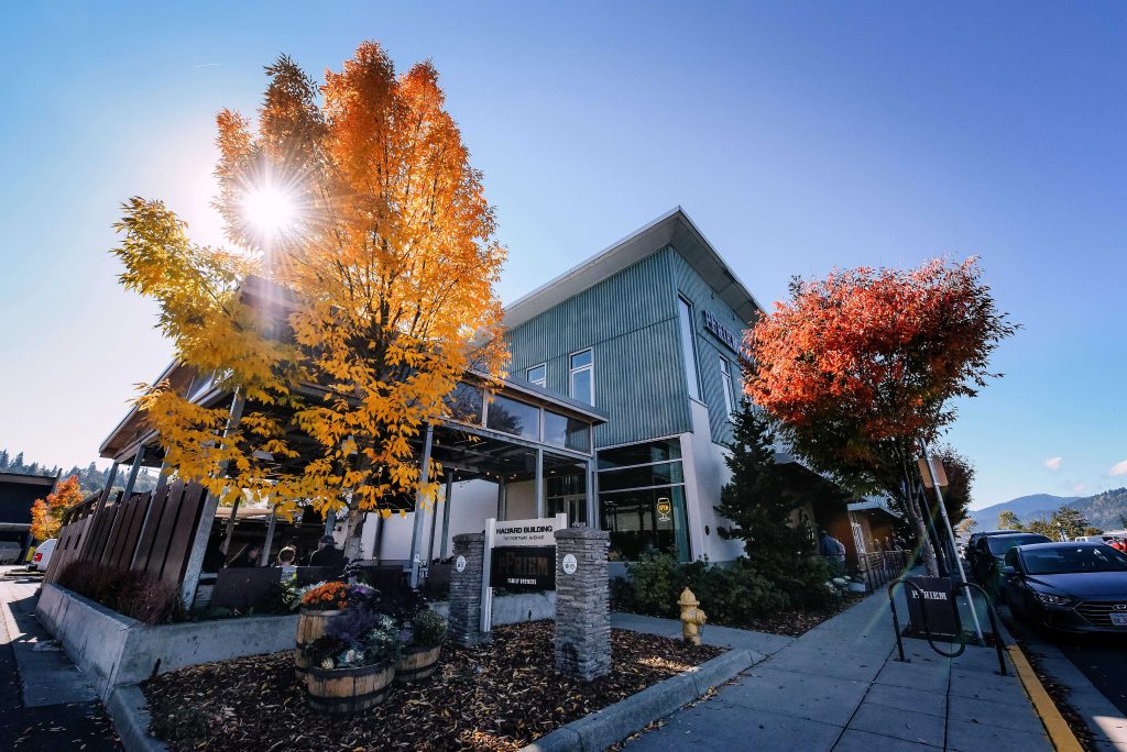 Outdoor view of pFriem with fall color trees and bright sunshine